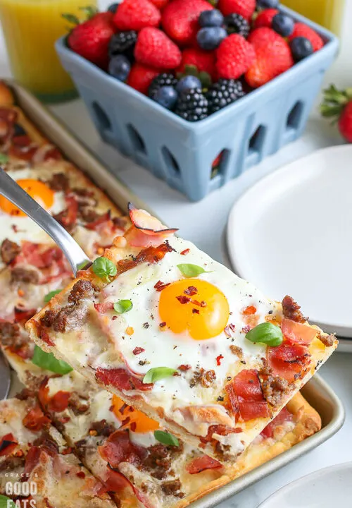 slice of breakfast pizza on a spatula