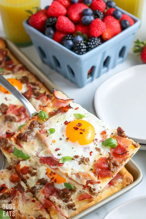 slice of breakfast pizza on a spatula