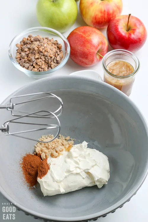 cream cheese and spices in a blue bowl