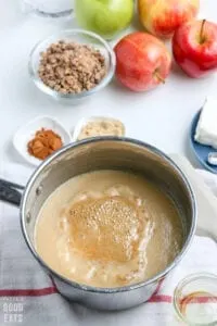 caramel sauce with vanilla on top in a sauce pan