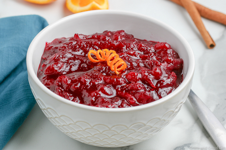 bowl of cranberry jelly with an orange peel twist