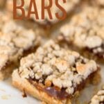 Pumpkin Bars Recipe made with pumpkin apple butter and a simple streusel crumb crust. These easy pumpkin bars come together quickly and are delicious with a dollop of whipped cream.