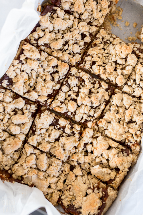 pumpkin bars in a pan with one cut out