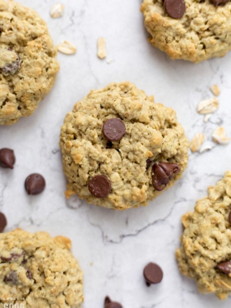 protein cookies on a countertop next to chocolate chips