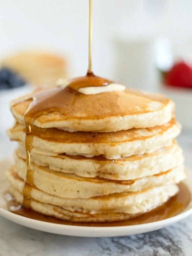homemade pancakes on a plate with syrup