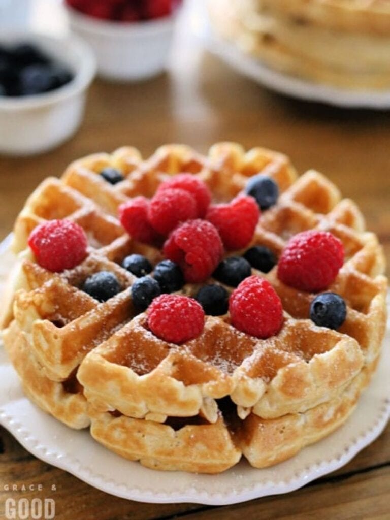 waffles on a plate topped with berries