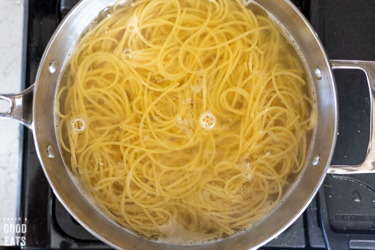 cooked noodles in a skillet with water