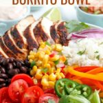 Make your own restaurant quality (or better) Chicken Burrito Bowl at home with this delicious recipe! These bowls are packed with a fresh flavors and filling protein.