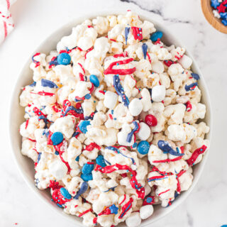 patriotic popcorn with red, white, and blue chocolate candies in a bowl