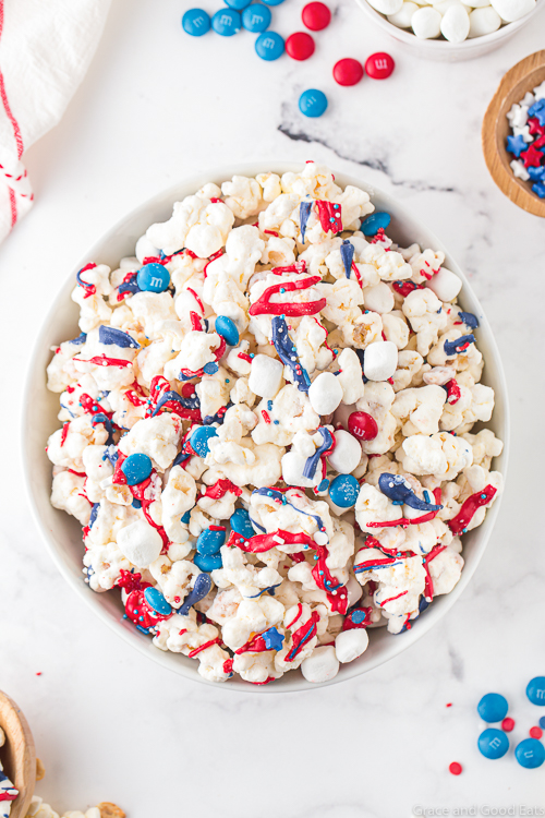 patriotic popcorn with red, white, and blue chocolate candies in a bowl