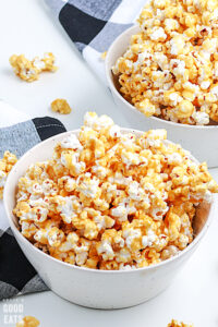 caramel corn in a white bowl