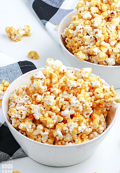 caramel corn in a white bowl