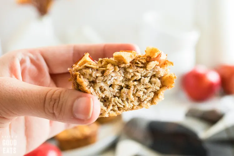 hand holding an oatmeal cup chopped in half