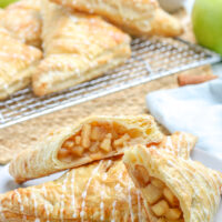 apple turnovers cut in half on a plate