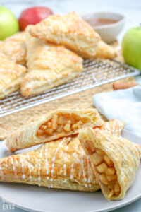 apple turnovers cut in half on a plate