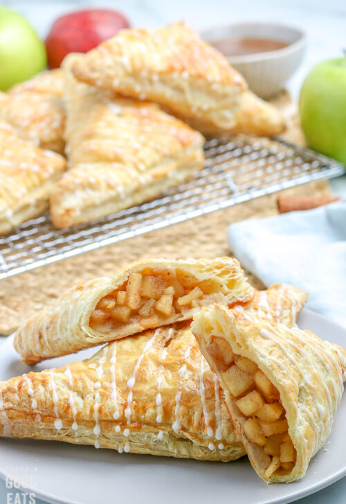 apple turnovers cut in half on a plate