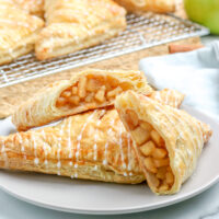 apple turnovers cut in half on a plate