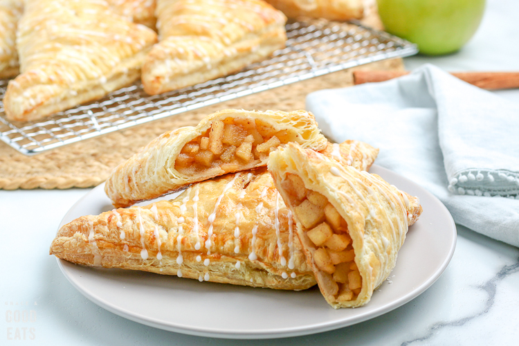 apple turnovers cut in half on a plate